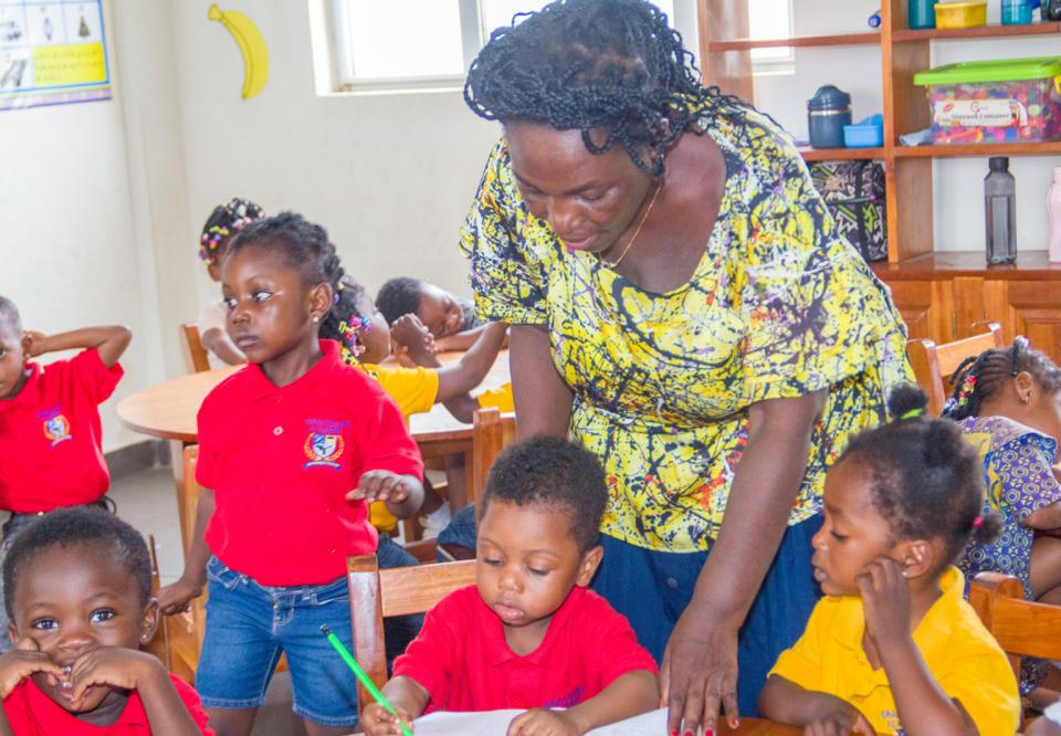 Founder of Graceham with Graceham students.